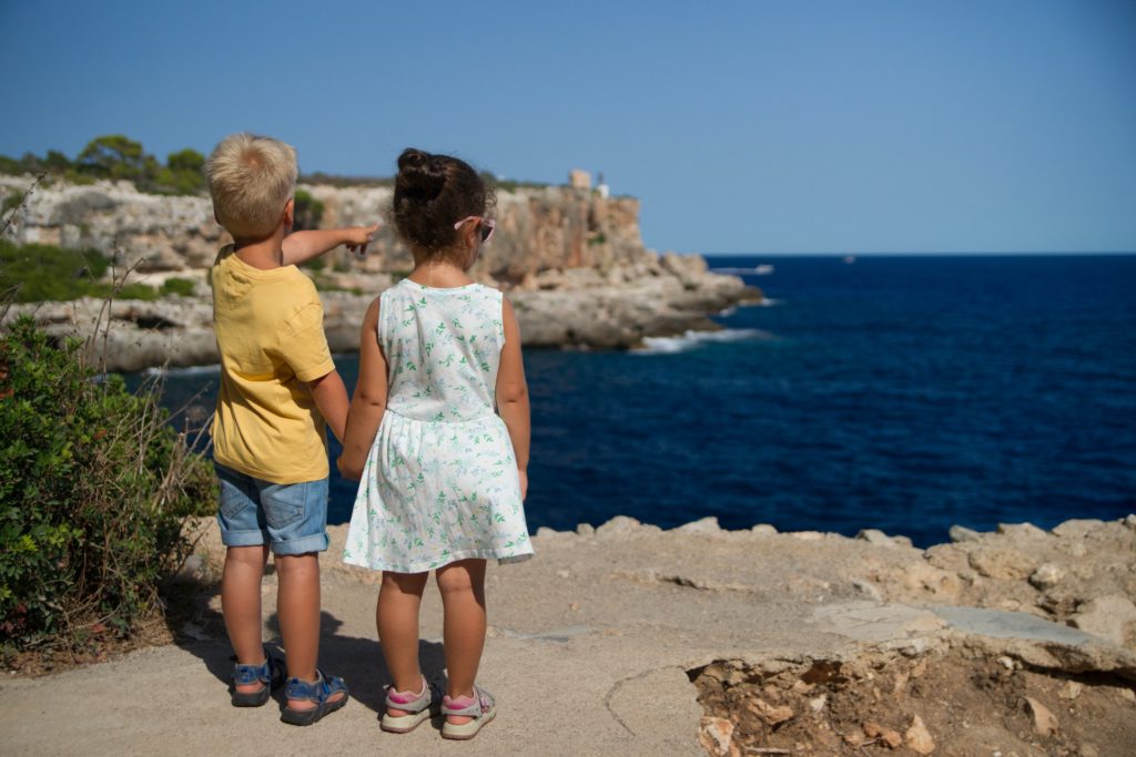 Two kids on vacation, American families traveling in Europe