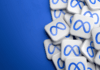 Americká společnost Meta vybuduje své první datové centrum v Kanadě Multiple white square tiles with a blue infinity symbol stacked on a blue background, suggesting a Meta/Infinity branding motif.